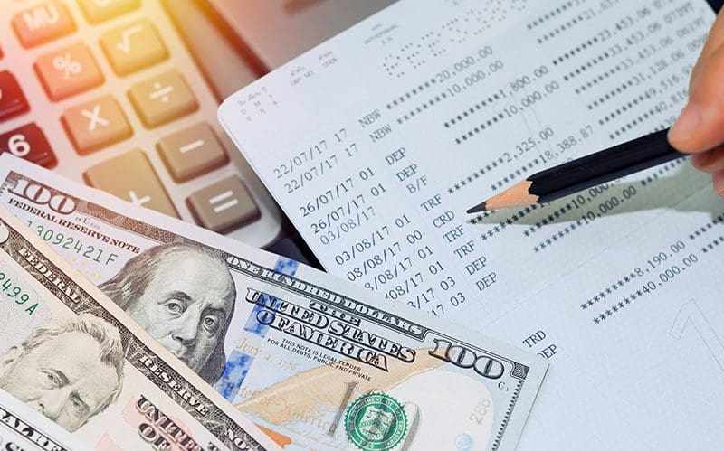 A bank passbook along with dollar notes